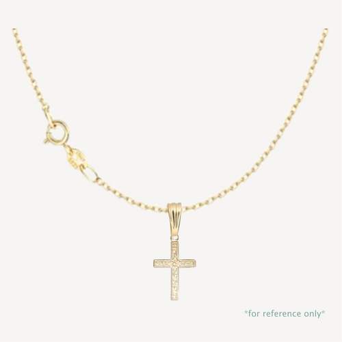 Gold cross pendant necklace on a white background