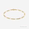 Gold and pearl bracelet on a white background