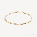 Gold and pearl bracelet on a white background